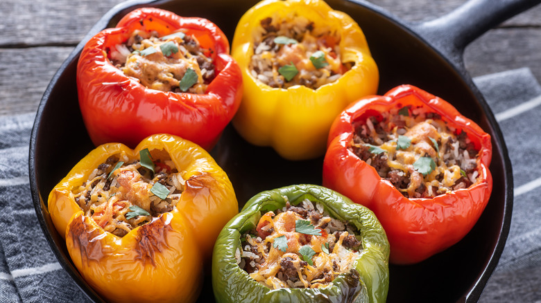 stuffed bell peppers on a black plate
