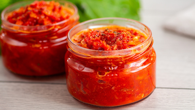 Homemade hot sauces in small clear jars