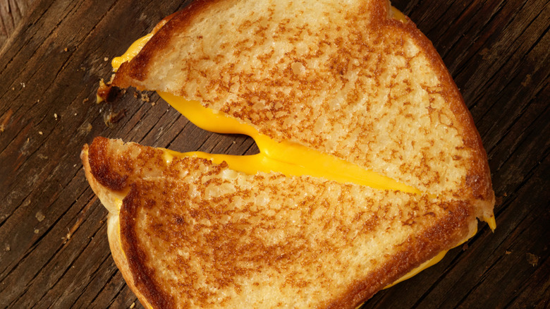 A halved grilled cheese sandwich.