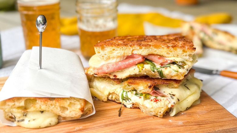 Grilled Italian picnic sandwiches on cutting board
