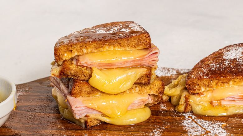 Monte Cristo sandwich sliced in half and stacked one on top of the other