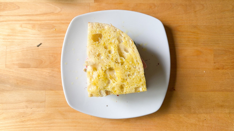 Focaccia sandwich brushed with olive oil on plate
