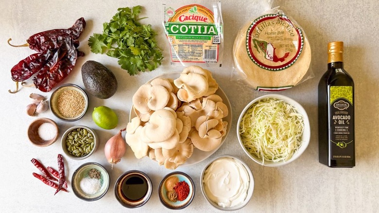 Grilled mushroom tacos with salsa macha crema ingredients on countertop
