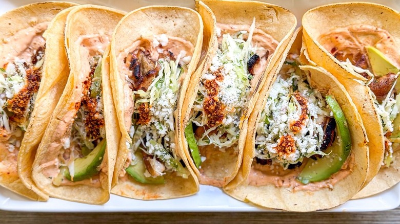 Grilled mushroom tacos with salsa macha crema