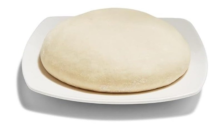 Whole Foods pizza dough resting on a white plate