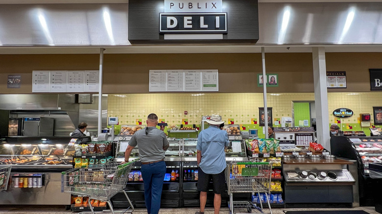 People standing at a deli in a Publix grocery store