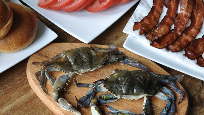 raw soft-shell crabs sitting on cutting board