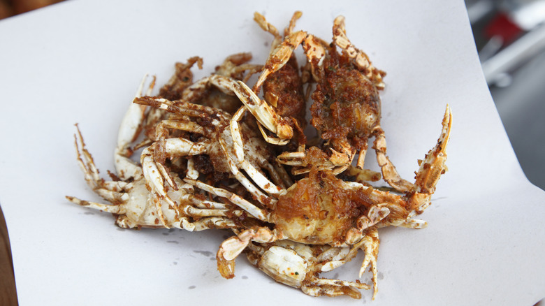 fried soft-shell crabs sitting on a plate