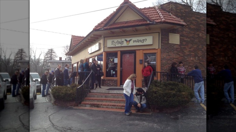 People lined up outside of Flying Mango restaurant