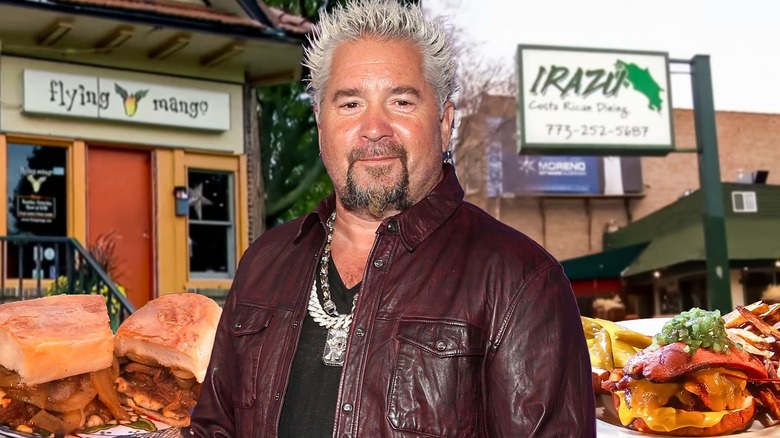 Guy Fieri in front of restaurants