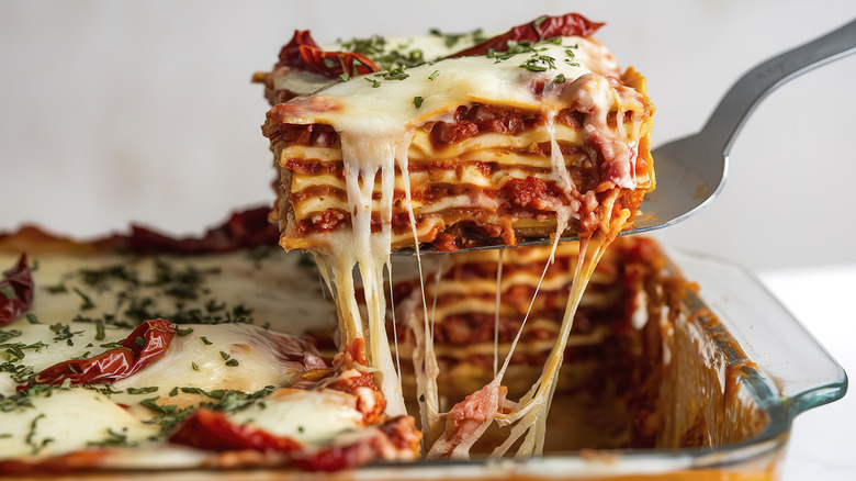 Spatula holding lasagna slice