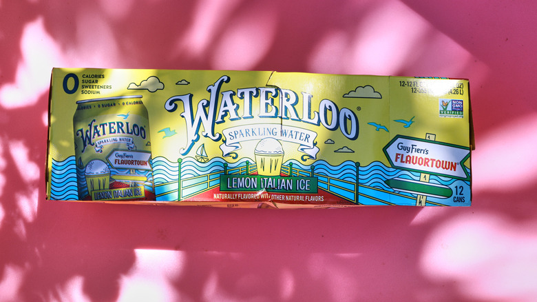 Case of Lemon Italian Ice soda on pink background