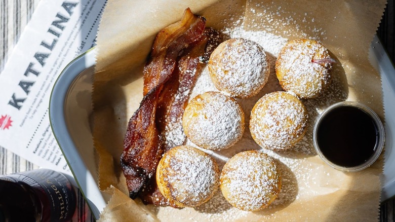 Katalina's pancake balls with a side of maple syrup and sweet-spicy bacon