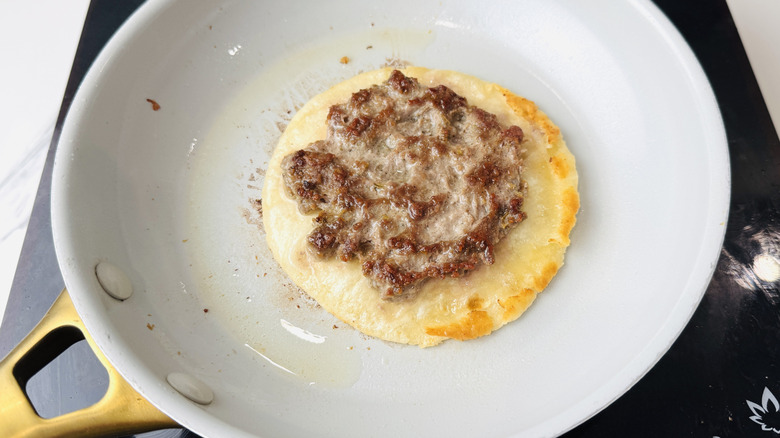 Cooking lamb tortilla in nonstick skillet
