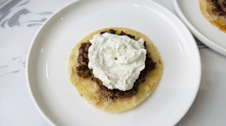 Lamb tortilla topped with tzatziki