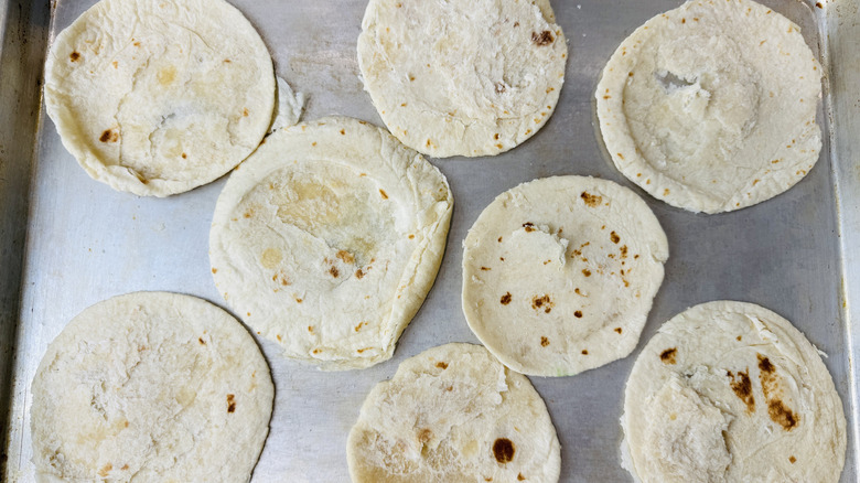 Flour tortillas on a baking sheet