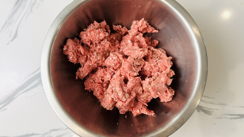 Ground lamb in mixing bowl