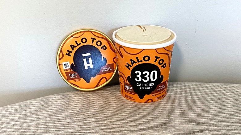 a pint of Halo Top Peanut Butter Cup ice cream on a table