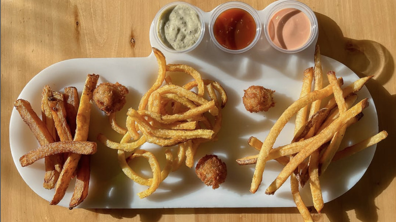 several styles of fries and three dipping sauces