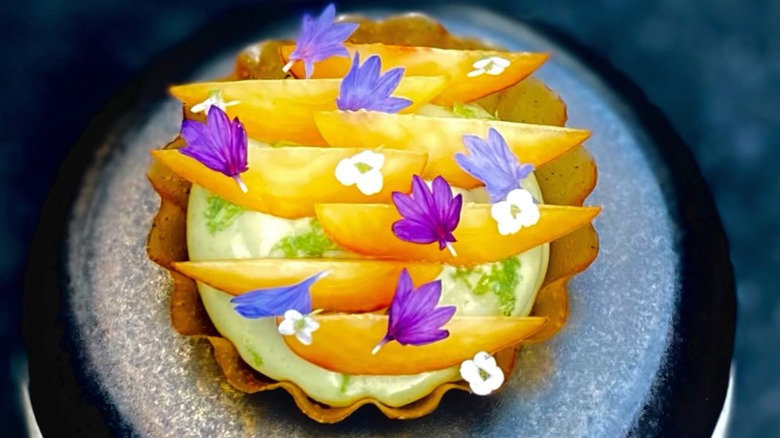 Stone fruit tart: nectarines, apricot glass, huacatay lime cream on a stone serving plate