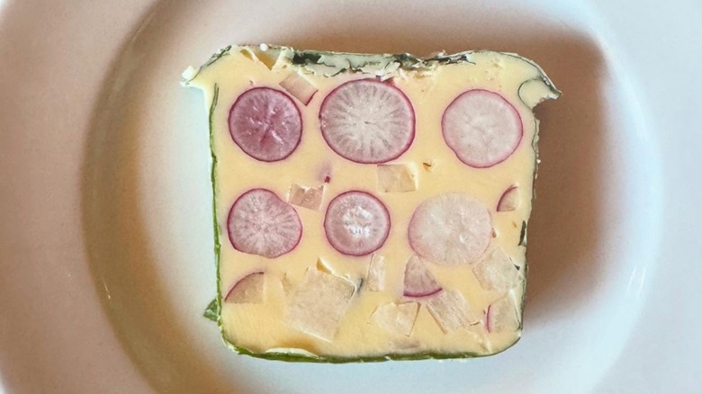 Radish terrine on a white plate