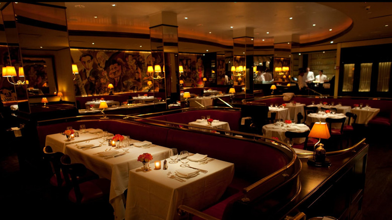 The interior of Monkey Bar, with white tablecloths and perfect table settings