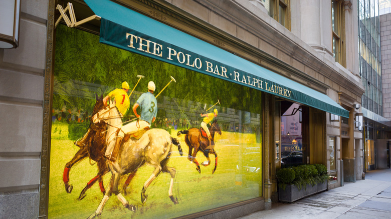 The street view of Polo Bar NYC with a large mural
