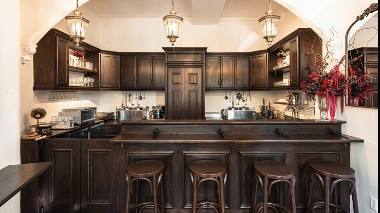 The interior of Ramen By Ra with four wooden stools