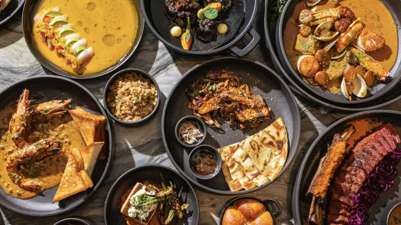 An assortment of dishes from Tatiana's laid out on a marble countertop