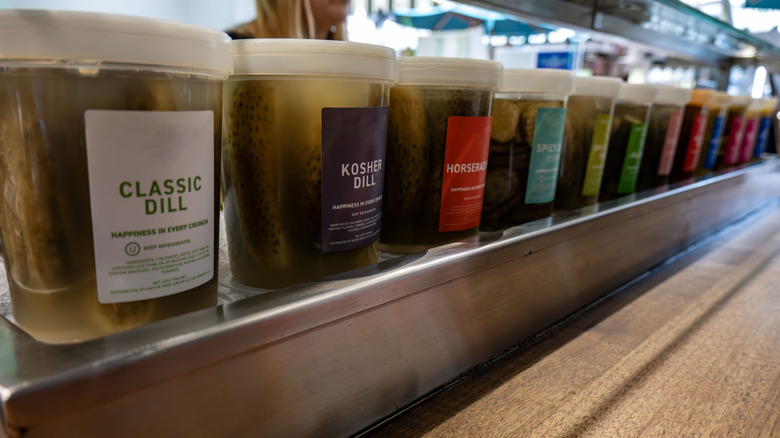 homemade pickles on display in a store