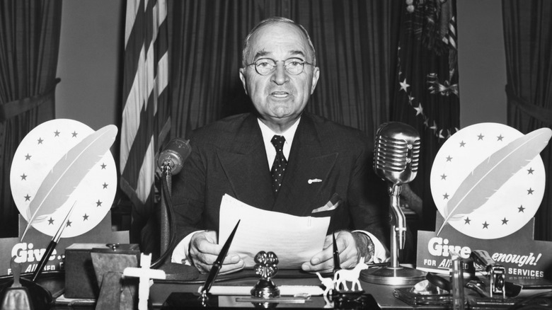 President Harry S. Truman giving a televised address from the White House
