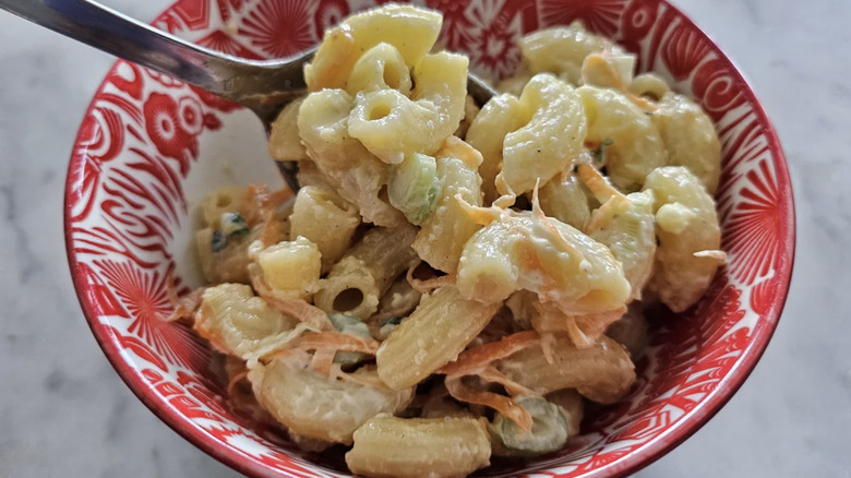 A small dish filled with Hawaiian mac salad