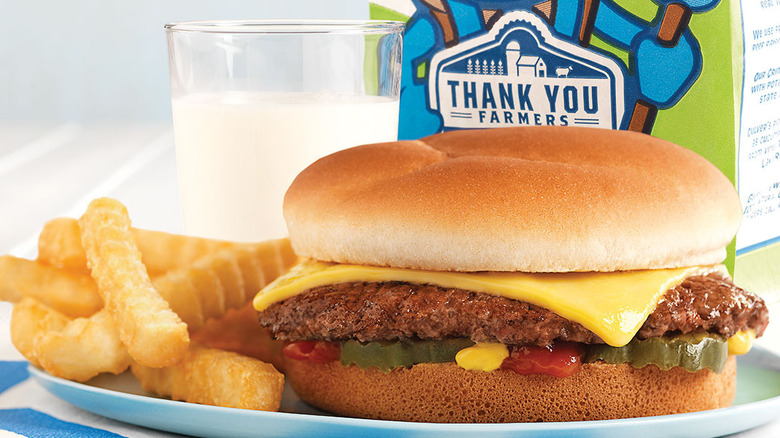 Culver's kids meal with cheeseburger, fries, milk, and a kids meal bag