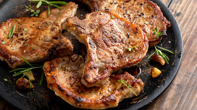 Platter of browned pork chops with bone