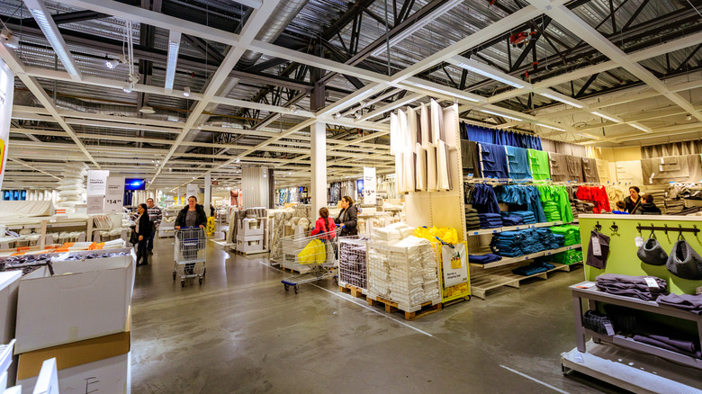 Customers shopping inside an IKEA furniture store