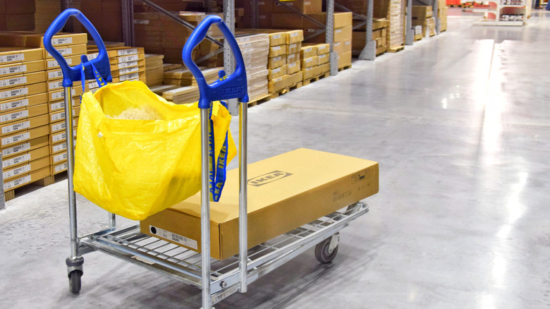 Ikea warehouse cart carrying a box and yellow bag