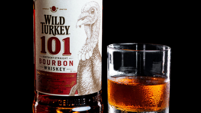 Wild Turkey 101 bottle and bourbon pour