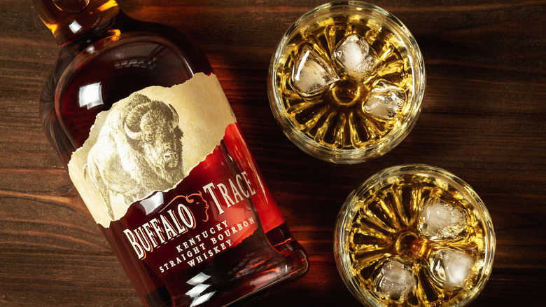 Bottle of Buffalo Trace bourbon with two glasses