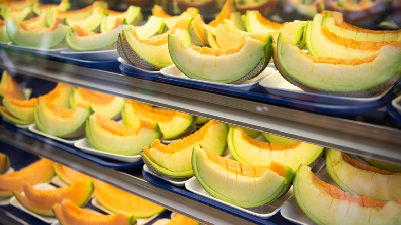 Slices of cantaloupe in a shop display