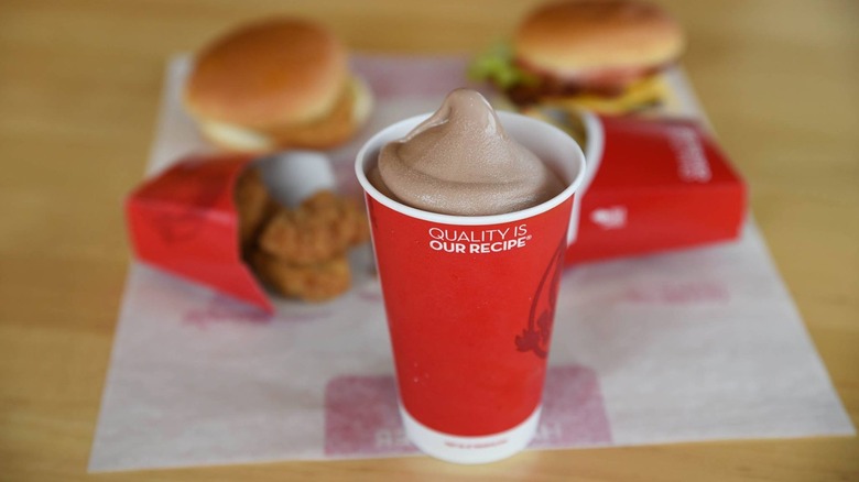 a wendy's frosty in front of other wendy's food