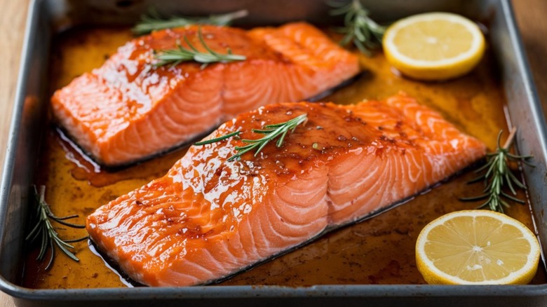 Two pieces of glazed salmon in a dish