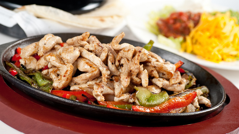 chicken fajitas on a cast iron