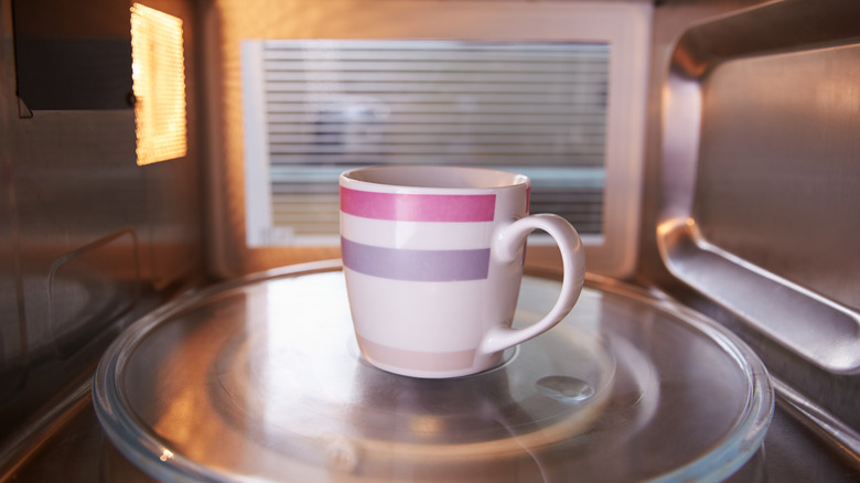 Coffee mug in a microwave