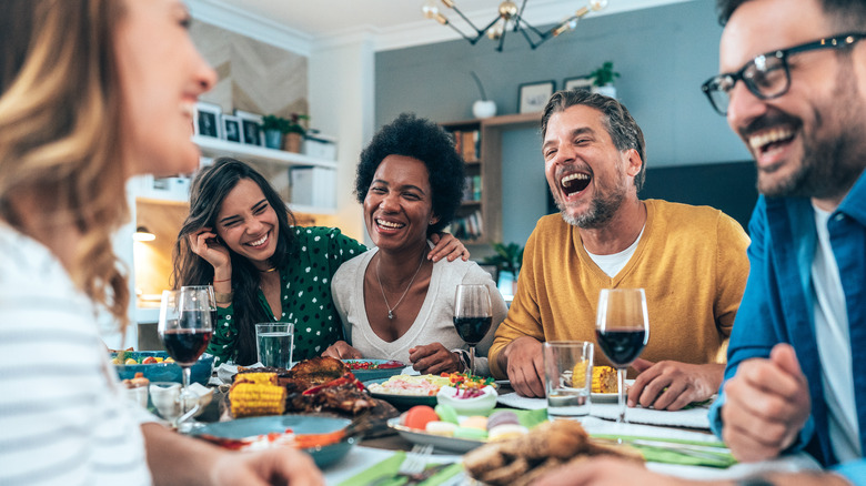 friends laughing at the table 