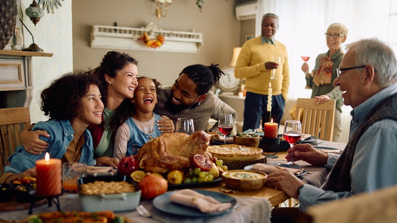 people gathered around the dinner table 