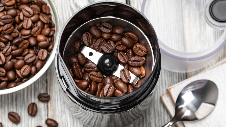 an electric blade coffee grinder with whole beans