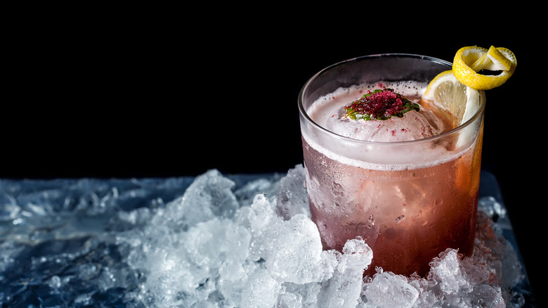 pink cocktail with sphere ice