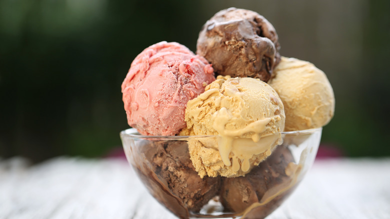 Several scoops of different ice cream varieties in a bowl