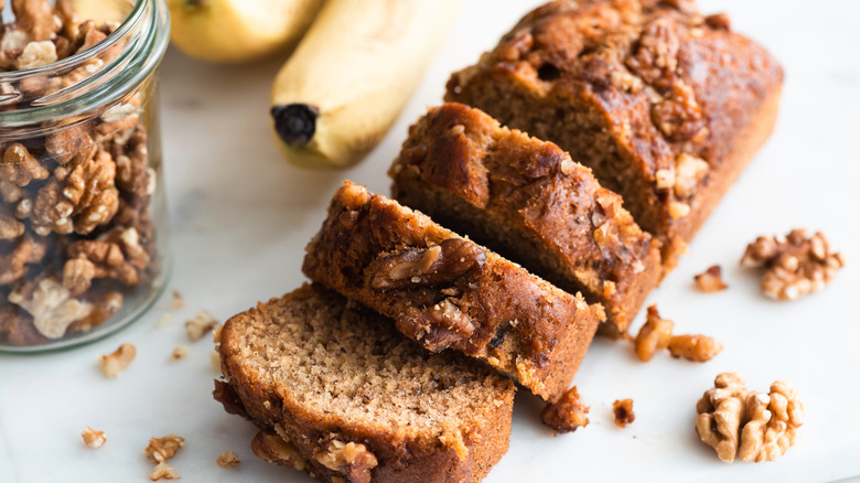 A small loaf of banana bread with walnuts