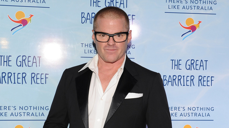 Heston Blumenthal against a blue backdrop